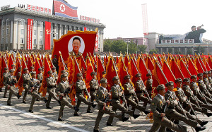 North Korean troops march past a portrait of the late leader Kim Jong Il during a military parade at Kim Il Sung Square to mark the 65th anniversary of the country's founding in Pyongyang, North Korea, Monday, Sept. 9, 2013. (AP Photo/Kim Kwang Hyon)